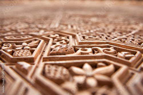 Detail of Islamic, Moorish, tile work at Alhambra, Granada, Spain. Great background texture. travel tourism destination La Alhambra