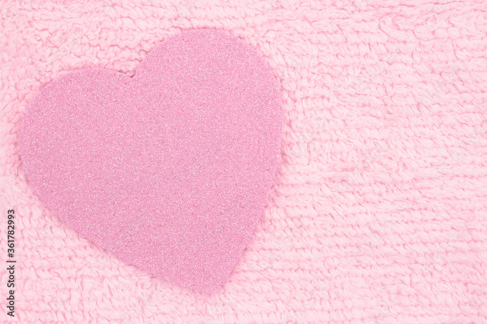 Pink sparkle heart on pale pink plush lined fabric background
