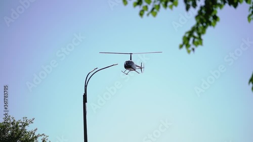 Helicopter flying and landing at airport airfield photo