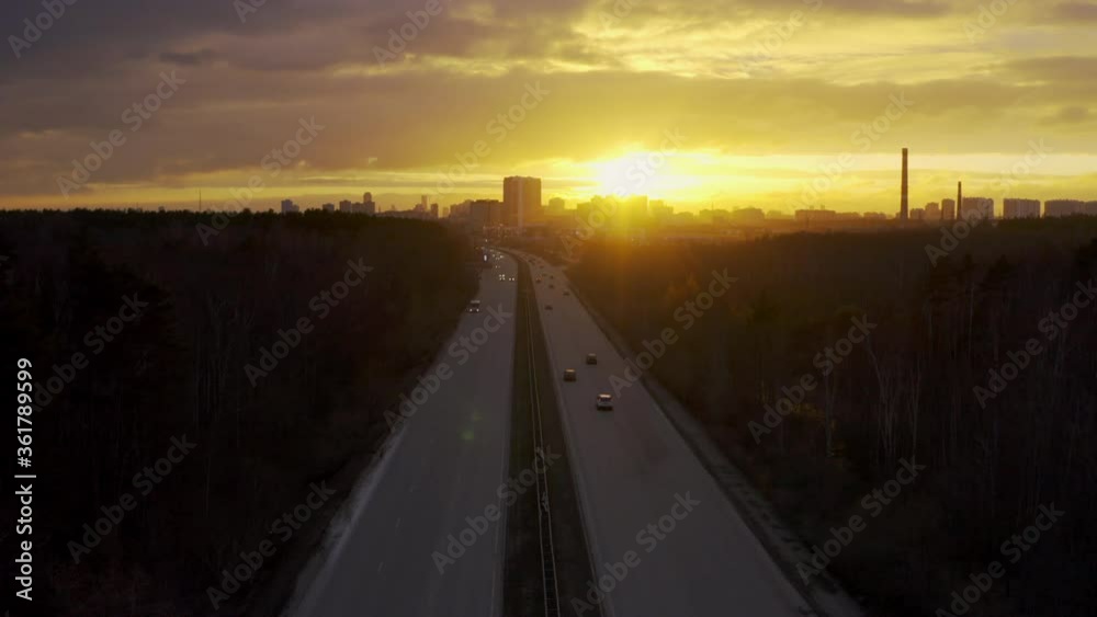 An aerial view of traffic on the track at sunset. An aerial view of traffic on the track at sunset.