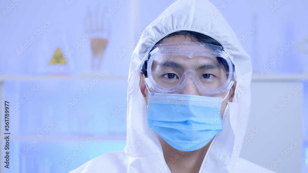 Portrait of Happy doctor or scientist man wearing Personal protective equipment Portrait of Happy doctor or scientist man wearing Personal protective equipment