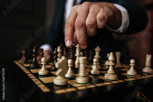 Wallpaper Mural man playing chess, hand holding chess board Torontodigital.ca
