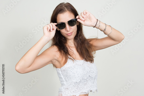 Portrait of young beautiful woman wearing sunglasses © Ranta Images