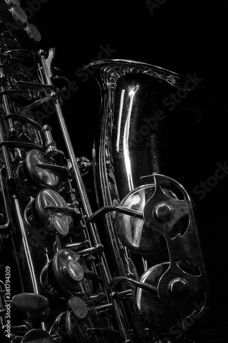 Detail of a saxophone  with dramatic lighting in black and white