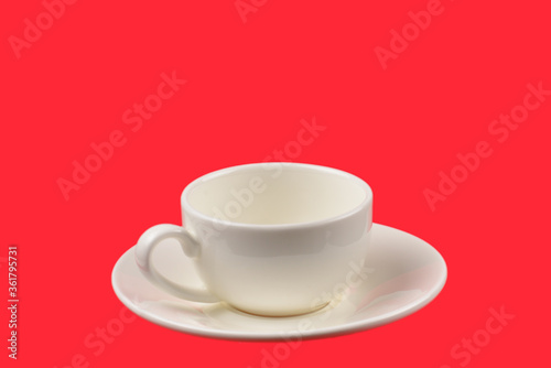 Empty cup on a red background.