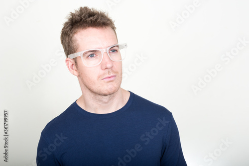 Face of handsome man with eyeglasses thinking © Ranta Images
