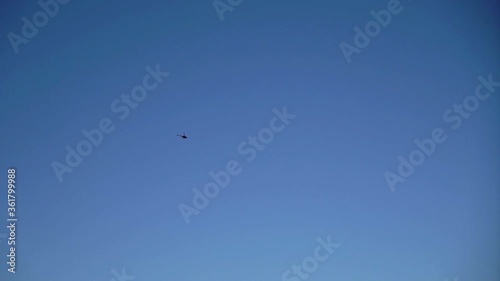 Helicopter flying and landing at airport airfield photo