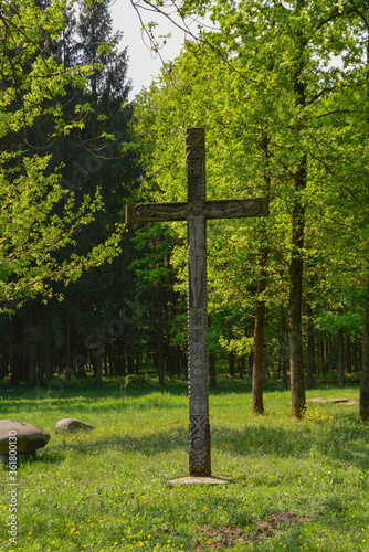 Obraz na płótnie Sapanta Peri Monastery, Maramures, Romania, Europe, spring 2018. Wooden cross in the gardens of the Sapanta monastery that has the highest bell tower in the world. Maximum height of 78 meters w salonie