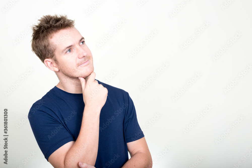 Portrait of handsome man thinking and looking up Portrait of handsome man thinking and looking up