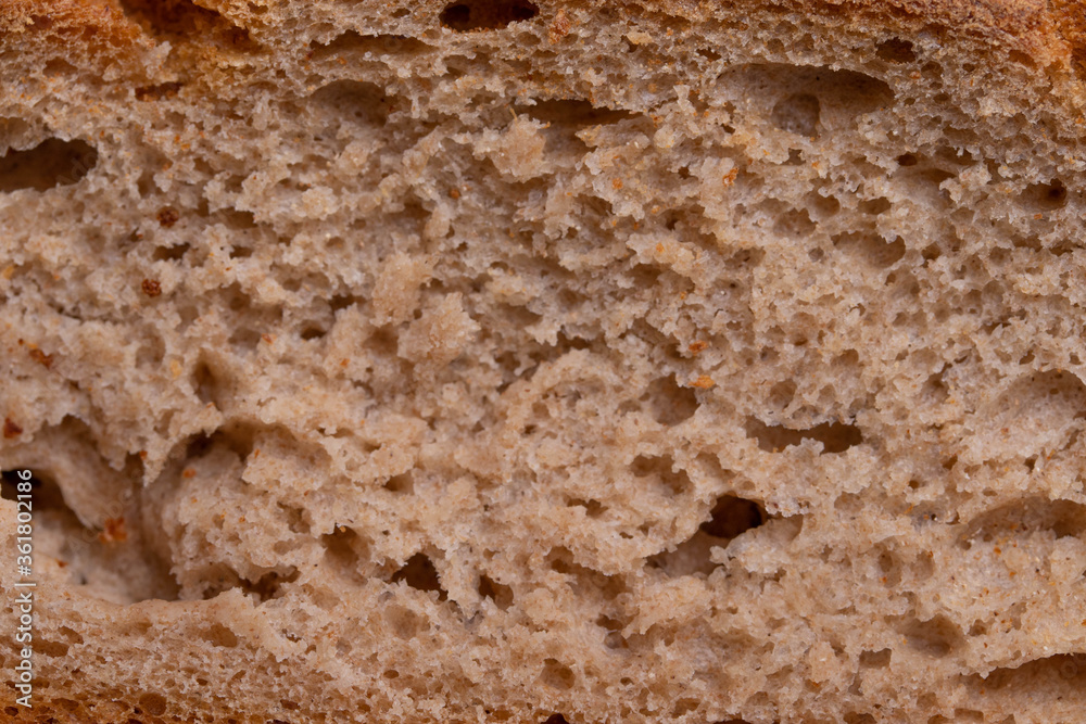 round single loan of brown bread on the stone concrete dark grey background round single loan of brown bread on the stone concrete dark grey background