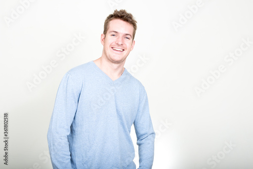 Portrait of happy handsome man smiling and laughing © Ranta Images