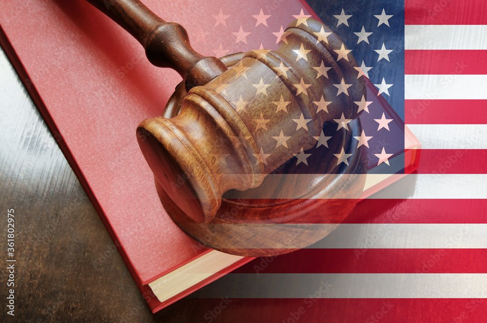 United States legal concept, judge wooden gavel and legal book with usa flag