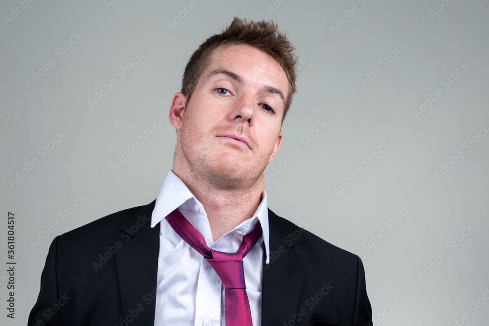 Portrait of handsome businessman in suit looking at camera Portrait of handsome businessman in suit looking at camera