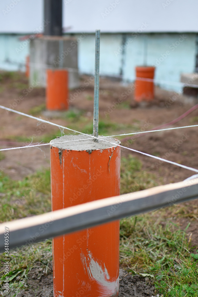Pillar foundation of terrace made of pipes filled with concrete and steel reinforcement.
