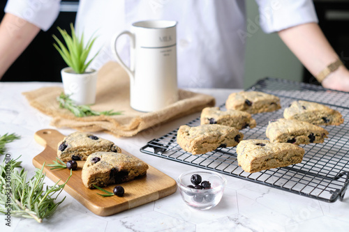 Triangle blueberry scones. a Traditional British baked good. set on cafe table.