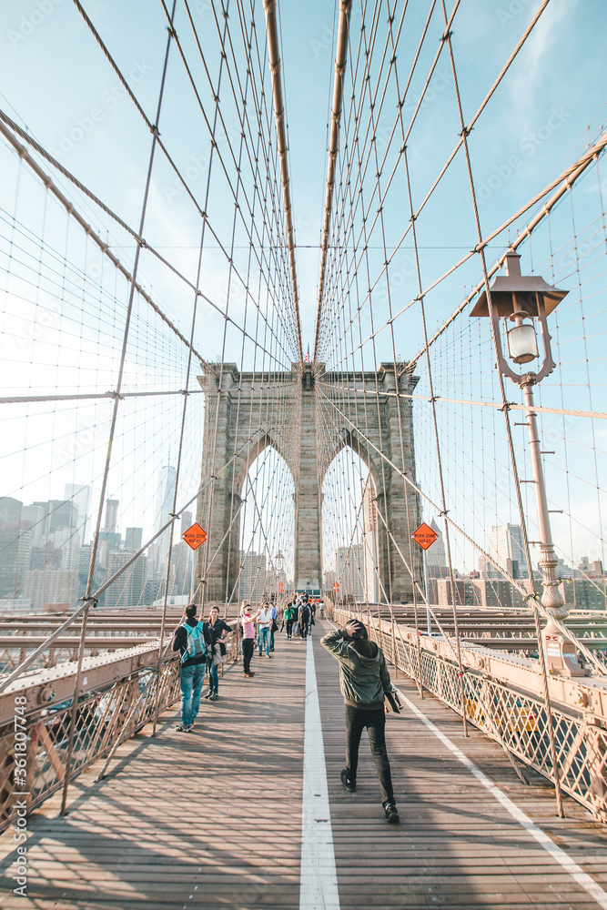 Fototapeta premium New York City, United States of America - May 26, 2016: Walking on Brooklyn Bridge in Manhattan, New York City NYC