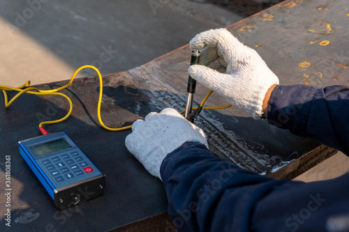 Brinell hardness test of steel and welded at heat affected zone(HAZ) after welding complete. photo