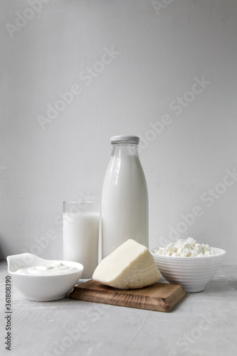 A variety of dairy products in a white and transparent bowl stat on a light background.