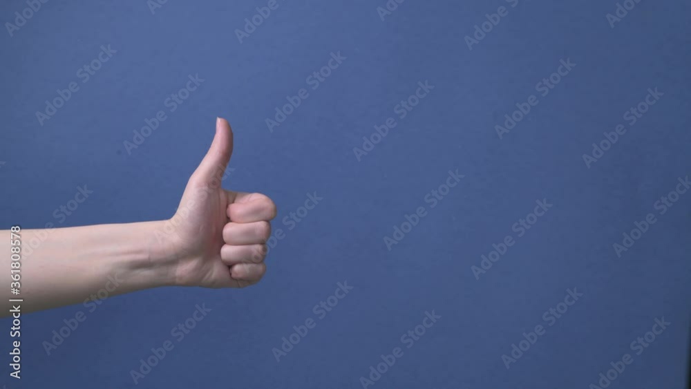 Thumb up close up, gesture, recommendation about a good choice Thumb up close up, gesture, recommendation about a good choice