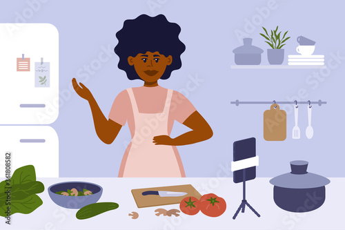 Black woman cooking on kitchen. Female blogger in apron preparing healthy food, making content by smartphone. Culinary video broadcast, channel or vlog with homemade meal recipe. Vector illustration.