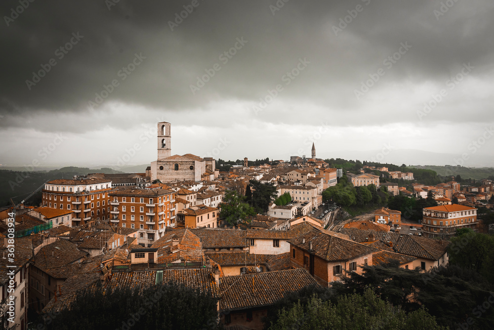 aerial view of the city of Perugia with the bell tower of the Basilica of San Domenico that stands out on all buildings