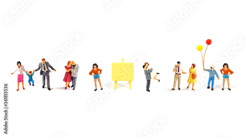 miniature people on white background.