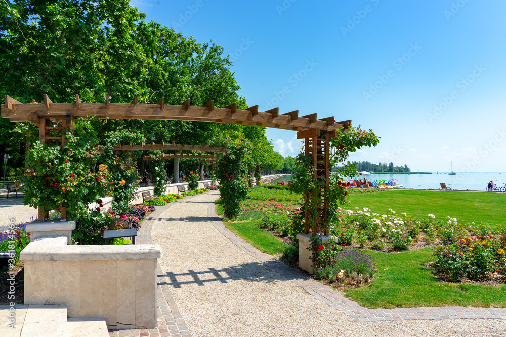 Pergola arbor Pathway park with flowers to lake Balaton in Balatonfured, Hungary