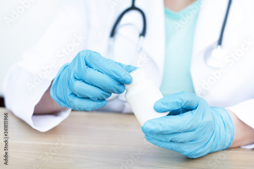 pills in the hands of a doctor close-up. Treatment concept