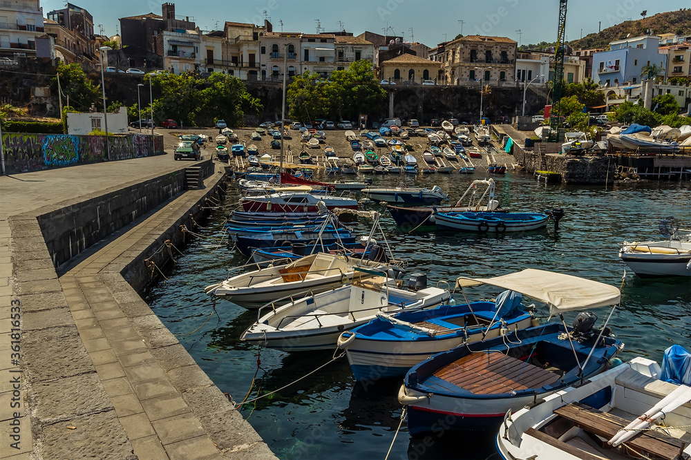 The harbour and vessels moored at Acicastello, Sicily in summer
