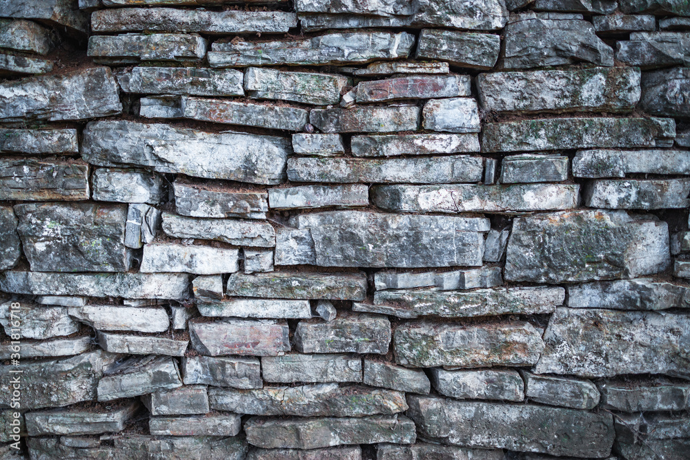 Old stone wall texture in a background Old stone wall texture in a background