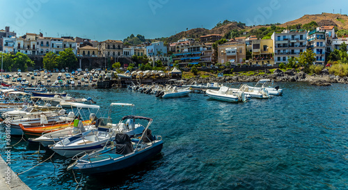The harbour and promenade of Acicastello, Sicily in summer