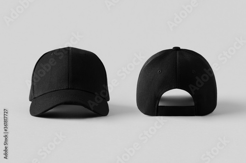 Black baseball caps mockup on a grey background, front and back side. photo