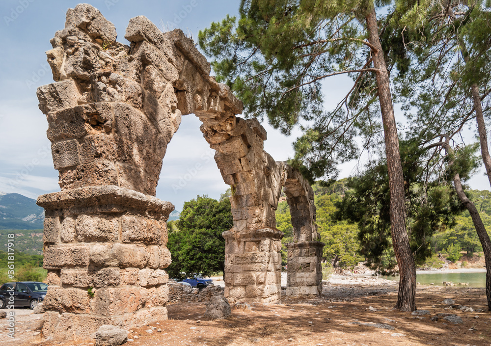 Ruins of aqueduct of ancient Phaselis city. Famous architectural landmark, Kemer district, Antalya province. Turkey.