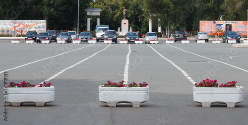Samara, Chapaevsk, Russia-September. 12. 2017: flowerbed with flowers in the Parking lot, marking in the Parking lot