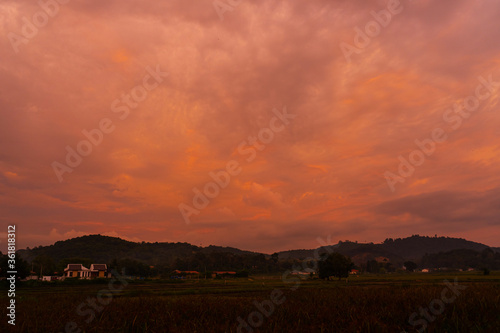 unusually beautiful fiery red tropical sunset in the mountains. © Kate