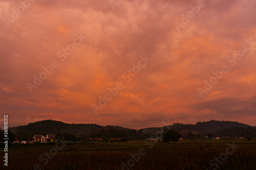 unusually beautiful fiery red tropical sunset in the mountains.