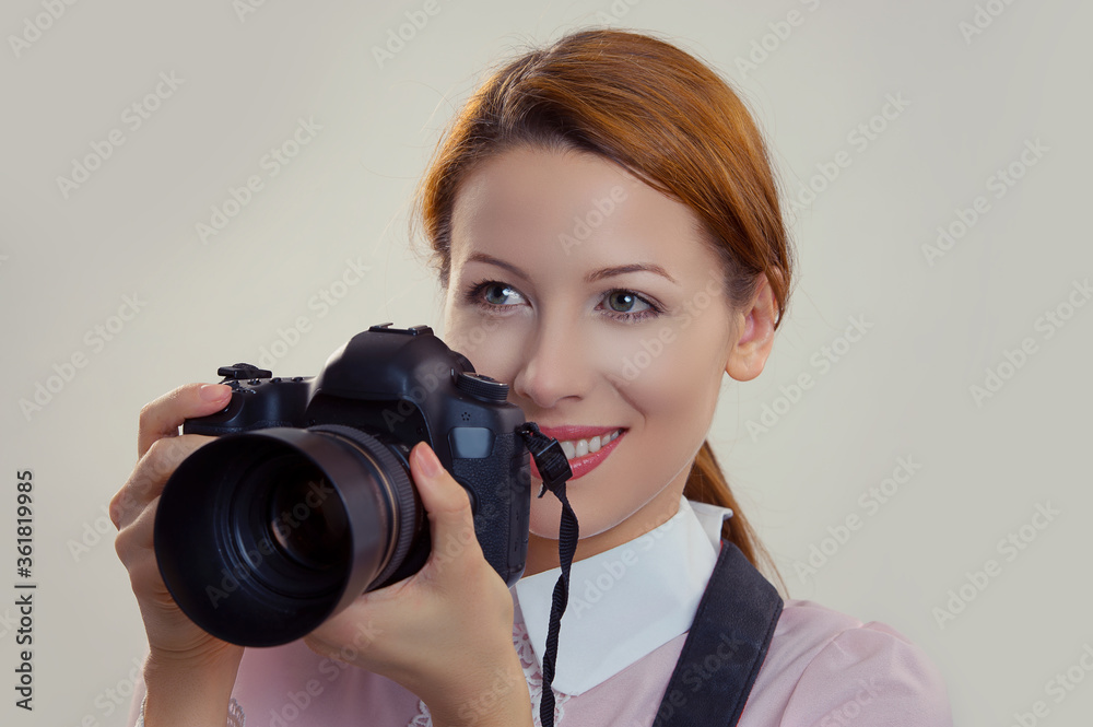 Photographer. Woman smiling, holding camera. Photographer. Woman smiling, holding camera.