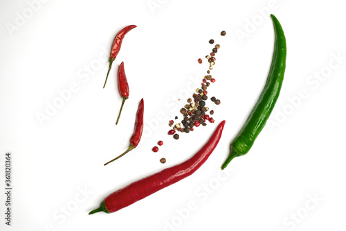 4 types of close-up peppers from above on a light background