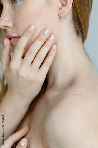 Close up of female neck and shoulder. Female clavicles and neck. Action. Female clavicle. Perfect skin of a young woman close-up