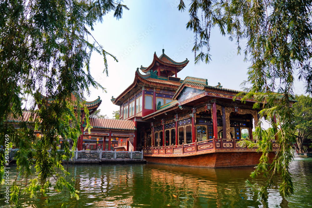 historic garden with traditional structures and popular water features filled with koi fish. Baomo park, Guangzhou China	