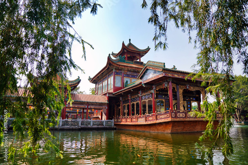 historic garden with traditional structures and popular water features filled with koi fish. Baomo park, Guangzhou China 