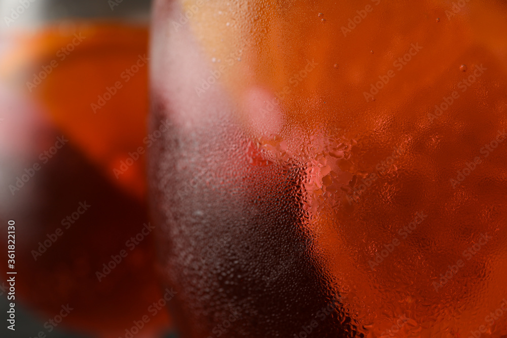Fototapeta premium Wet glass with aperol spritz cocktail, close up