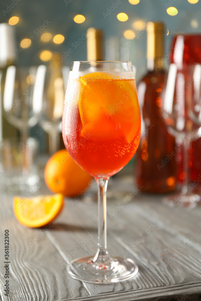 Composition with aperol spritz cocktail and blurred lights. Summer drink Composition with aperol spritz cocktail and blurred lights. Summer drink