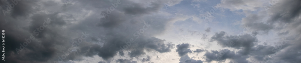 Panorama of dark gray stormy sky, gray clouds cover the sky