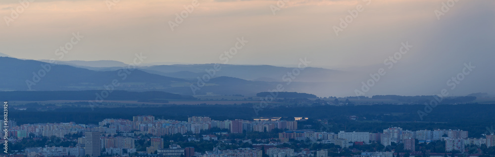 Panoramic view to city Ceske Budejovice with rain storm. Moody weather, Czech republic