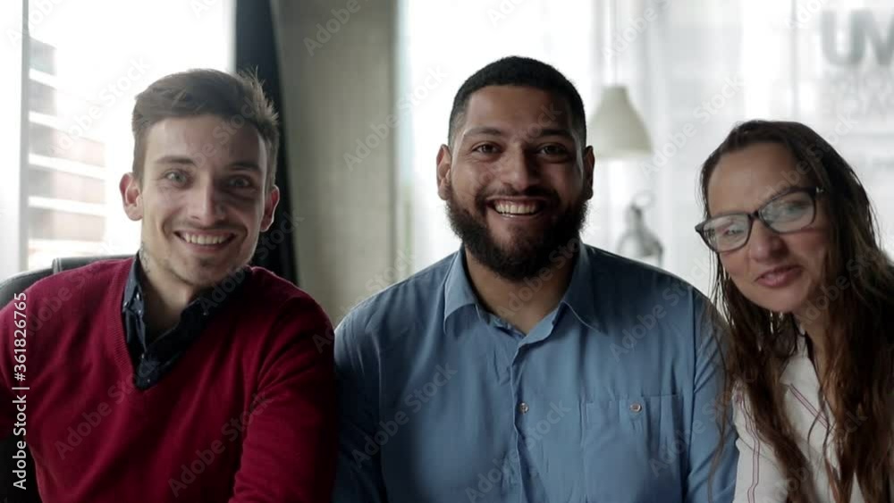 Business team of happy people waving hello at camera, smiling and speaking. Pov shot, front view. Business communication concept Business team of happy people waving hello at camera, smiling and speaking. Pov shot, front view. Business communication concept