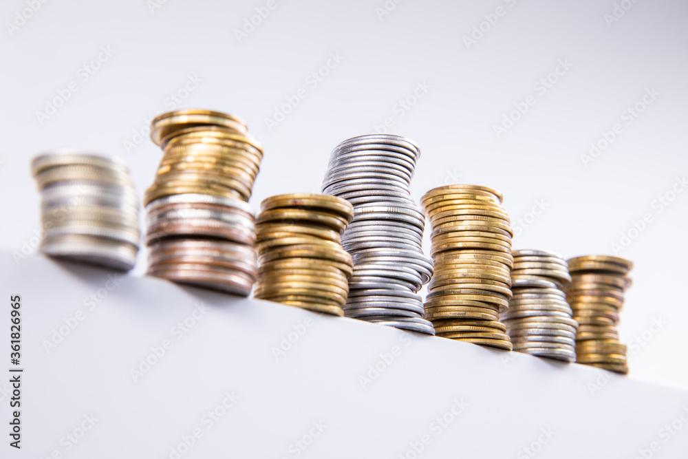 collection of colorful metal coins isolated on white background, close view collection of colorful metal coins isolated on white background, close view