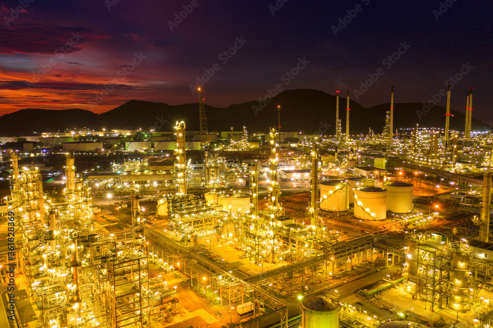 Aerial view Oil refinery.Industrial view at oil refinery plant form industry zone with sunrise and cloudy sky.Oil refinery and Petrochemical plant at dusk Thailand. Oil refinery background.