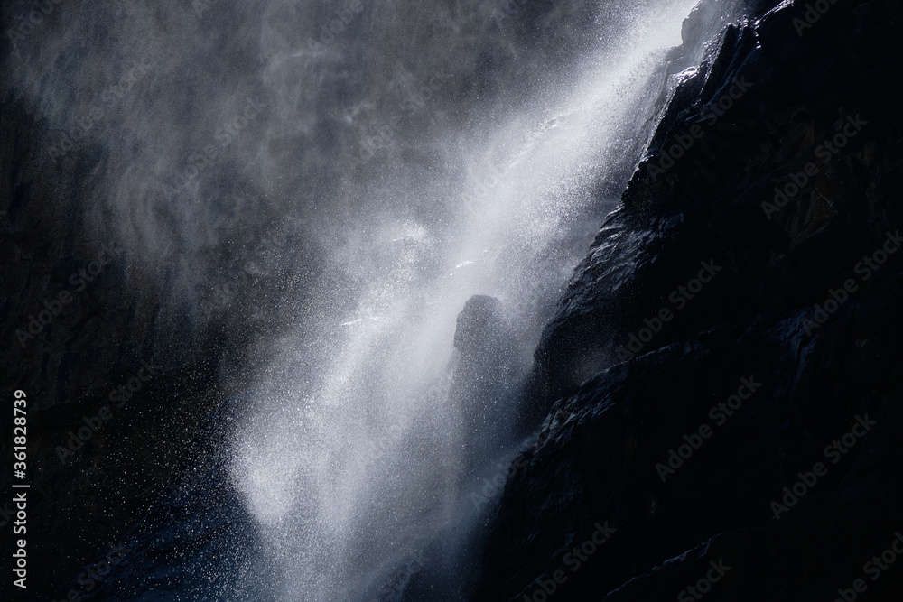 Fototapeta premium water falling at high speed in a ray of light