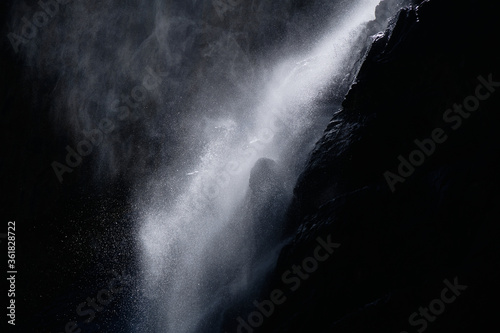 water falling at high speed in a ray of light